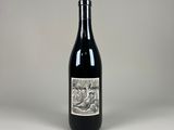 a bottle of wine that is sitting on a table