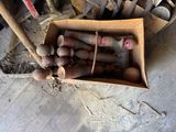 a cardboard box full of different types of tools on the floor