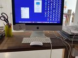 a desktop computer sitting on a desk with a keyboard and mouse