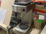 a machine that is sitting on a shelf in a store