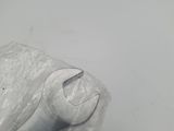 a piece of plastic wrapped in plastic and a wrench