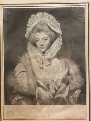 portrait of a woman in a fur coat and bonnet with a cat