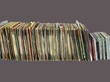 a lot of records stacked on top of each other
