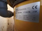 a label on the side of a yellow water heater