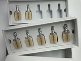 several bottles of perfume sitting in a display case