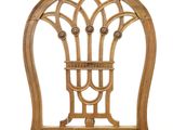 an image of a wooden chair with a wicker seat on a white background