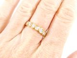 an image of a woman ' s hand with a ring on it