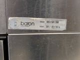 a close up of a stainless steel refrigerator with a sticker on it