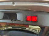 a close up of a car ' s dashboard with a stop button