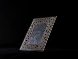 a picture frame sitting on a table in the dark