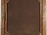 painting of a wooden frame with a brown background on a white wall