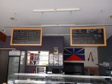 two menus on the wall above the counter