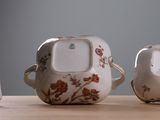 three different types of teapots on a table