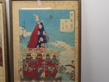 two framed pictures of a man riding a horse and a woman riding a horse