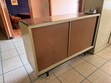 a cabinet that is sitting in the middle of a room
