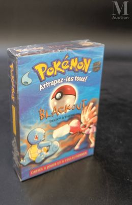 a box of pokemon trading cards sitting on a table