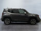 the jeep renegade is parked in a large room with a gray floor
