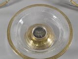 a glass bowl with a gold rim and a glass bowl with a gold rim and a glass bowl with a gold rim and a glass bowl with a gold