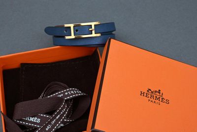 an orange box with a black belt and a blue belt