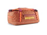 a duffel bag that is sitting on a white surface