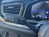 a close up of a car dashboard with a steering control