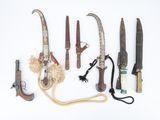 many different types of knives on a white surface