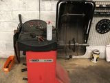 a machine that is sitting in a garage next to a wall
