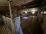 a room with a lot of stalls inside of it