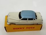 dinky toys white car with blue top in box on white surface