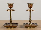 pair of antique brass candlesticks with blue and white glass accents