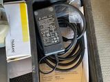 a box that has a charger and a cord in it