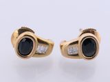 an image of a pair of black and white diamond earrings