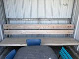 a bench and a table in the back of a truck