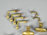 many different types of brass faucets on the table