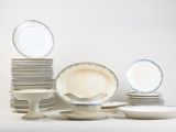 a lot of plates and cups on the table