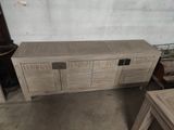 an image of a wooden entertainment center in a garage