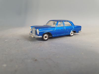 a blue toy car that is sitting on a table