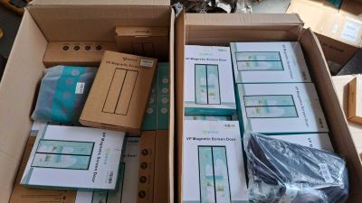 a box full of boxes of electronic equipment in a room