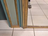 a person standing in front of a mirror in a bathroom