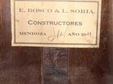 an old wooden cabinet with a sign on it that says e boscoo & l soria
