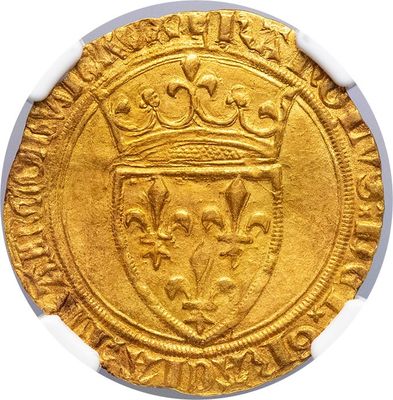 a close up of a gold coin with a crown on it
