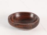 wooden bowl on a white surface with a white background