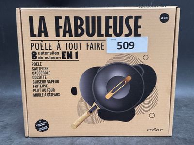 the box of a black frying pan with a wooden handle