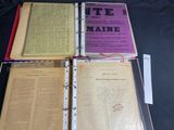 three open books sitting on top of each other on a table