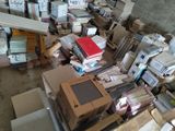 a pile of boxes and boxes of books on the floor