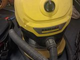 a yellow vacuum cleaner sitting on top of a table