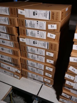 many boxes stacked on top of each other on the floor