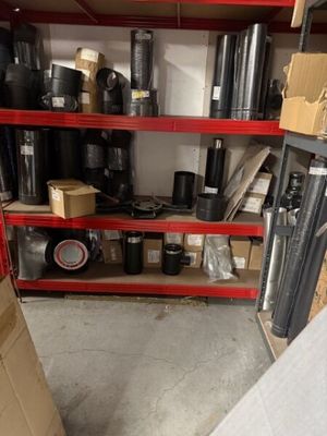 many rolls of black tape on the shelves in the warehouse