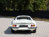 a white car that is parked on the side of the road