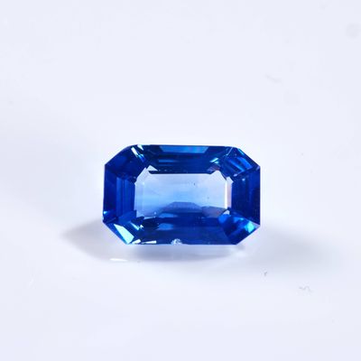 a blue sapphire stone on a white background